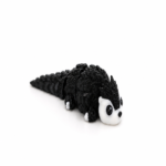 Zookies Articulated Baby Otter: black otter figure with a white face and long tail